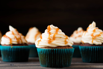 Caramel cupcakes on a dark background