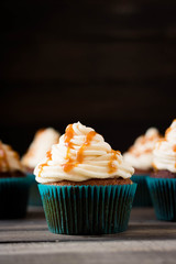 Caramel cupcakes on a dark background