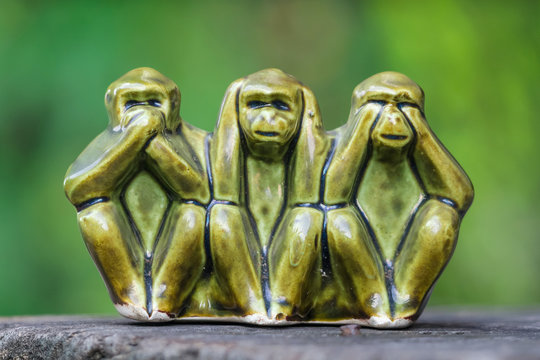 Close up Monkey statues made of ceramic in concept of see no evil, hear no evil and speak no evil.