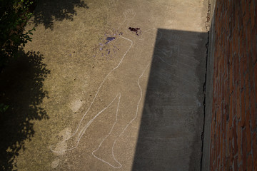 Crime scene. Shape of body on concrete texture