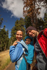 Family with infant visit Sequoia national park in California, USA