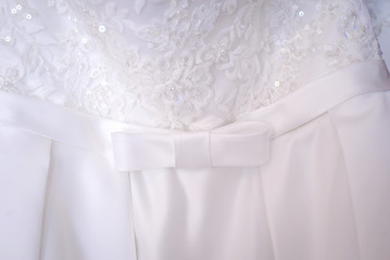 White bow on the bride's dress