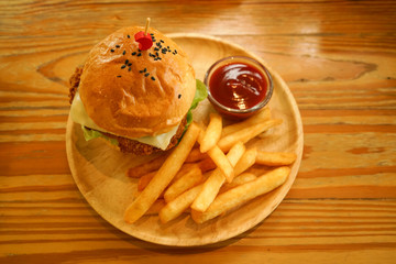 hamburger and chip tomato ketchup dip on wood table