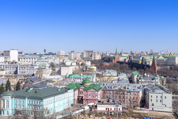 view of Moscow cityscape, old historical town and urban skyscrapers (Moscow International Business Center background) with sunny blue sky, Moscow city, Russia