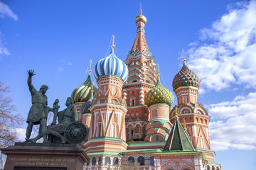 Moscow,Russia, St. Basil's Cathedral and Kremlin Walls and Tower in Red square in sunny blue sky....