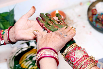 Application of henna as skin decoration in Indian Wedding, Wedding at the indian ceremony