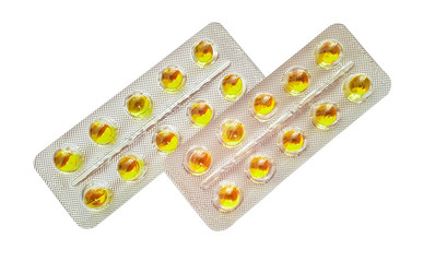 gelatinous yellow capsules omega 3 in a package on a white background, isolate