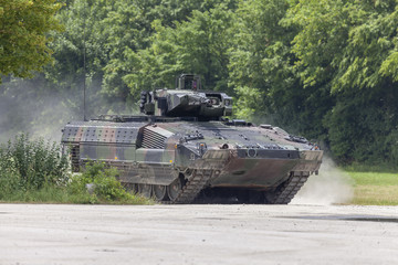 German infantry fighting vehicle drives on a street