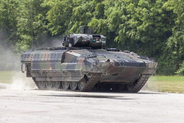 German infantry fighting vehicle drives on a street