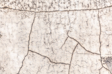 Dry cracks of paint on wall textured pattern background