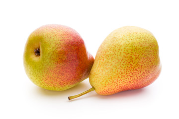 Fresh bio pear with leaves on isolated white background.