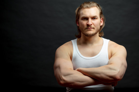 sexy powerful guy with ferm flesh musculars.muscular force concept.
