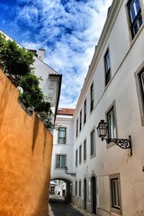 Fototapeta na wymiar Old colorful houses and narrow streets of Lisbon