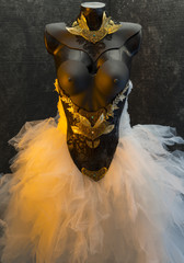 Marriage gothic wedding dress. takes pieces in gold and precious metal lace on black corset. handmade piece with thermoplastic materials and metals