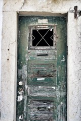 Old and colorful wooden door with iron details