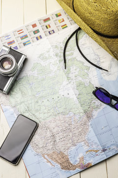 Background accessories for traveling with america map, photo camera etc.