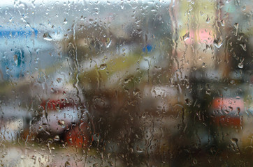 Raindrops on the street window. Bad weather, thunderstorm.