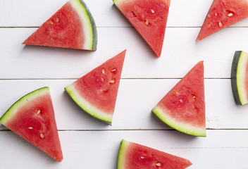 watermelon pieces in a wooden background