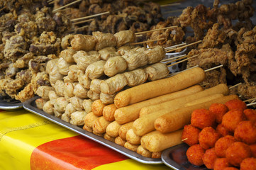 Sausages and other processed foods are packed with skewers and served on table. Sell by street...