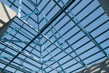 Fototapeta na wymiar Structure of steel roof frame for building construction.