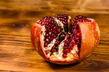 Fresh ripe garnet fruit on wooden table