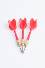 Three red darts on a white background