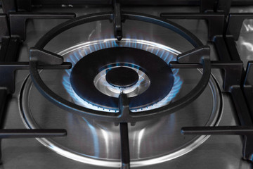 Stove turbo burner with burning flame closeup