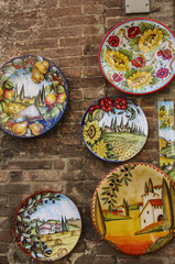 Traditional ceramic plates with views of Italy in one of the souvenir shops