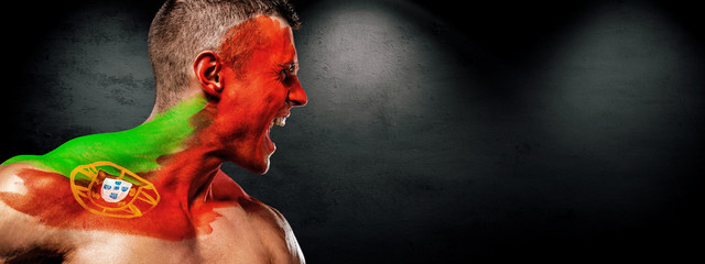 Soccer or football fan with bodyart on face - flag of Portugal.