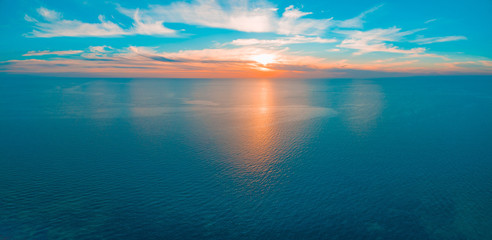 Obraz na płótnie Canvas Minimal aerial panorama - seascape sunset over ocean