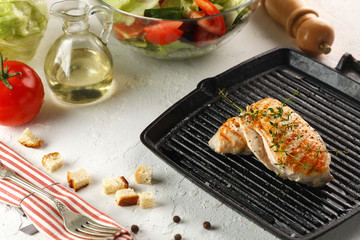 grilled chicken with spices on black grill pan