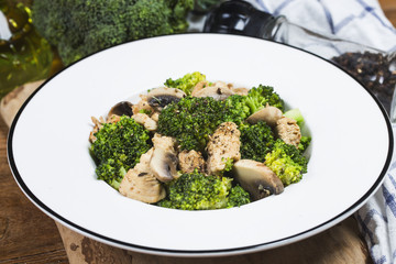 Stir fry with chicken, mushrooms and broccoli low carb high protein recipes. Healthy fat burning eating concept.