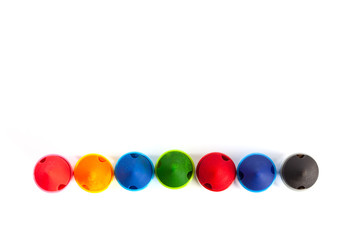 Row of chunky large kids markers on white background - top view with copy space