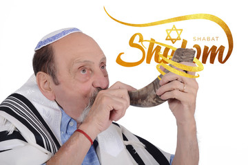 Eldery jewish man blowing the Shofar horn for Rosh Hashanah