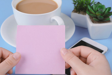 Woman's hand holding empty card