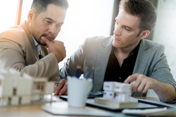 Business partners showing team work while working in meeting room at office interior Business consultant concept. Team work and successful project.