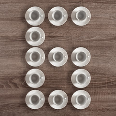 Alphabet letter G made of empty coffee cups