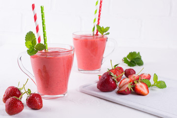 Delicious strawberry smoothie. Morning drinks with fresh berries, yogurt or milk