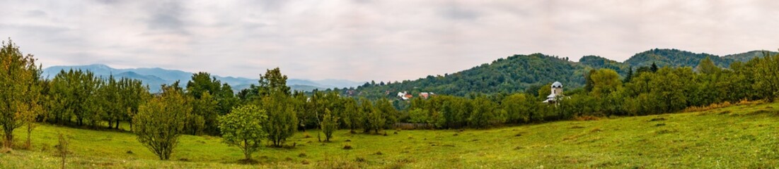 Fototapeta na wymiar Spring colors in the country village. Valea Plopului village, Prahova county, Romania.