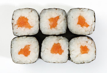 Rolls of Hosomaki with salmon, top view, white background