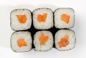 Rolls of Hosomaki with smoked salmon, top view, white background