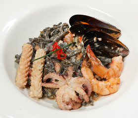 Vietnamese style noodles (original black noodles with sea cocktail, mini octopuses, squid, shrimp and blue mussels in cream)
