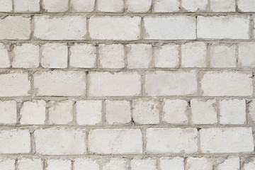 Obraz premium White stone wall, wall of white brick, background, texture