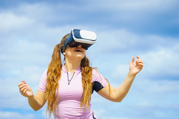 Woman wearing VR outside