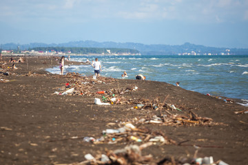 The problem of pollution and ecology of the sea shore and the ocean. Garbage on the coastline and in the world