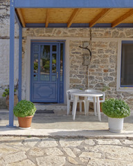 Greek island house entrance with blue door