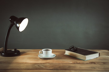 cup of coffee with book on the table