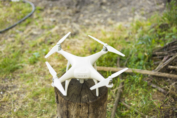 The modern drone on the background of trees and forests