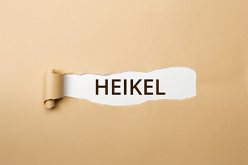 HEIKEL Schriftzug - aufgerissenes Papier