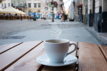 street cafe in Europe, cup of coffee on cozy vintage cafe terrace